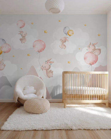 Bunnies with balloons on clouds among mountain peaks