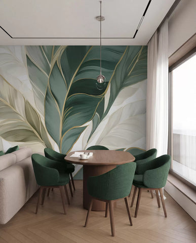 Large green and cream tropical leaves wall mural with gold veins in a dining room with green velvet chairs
