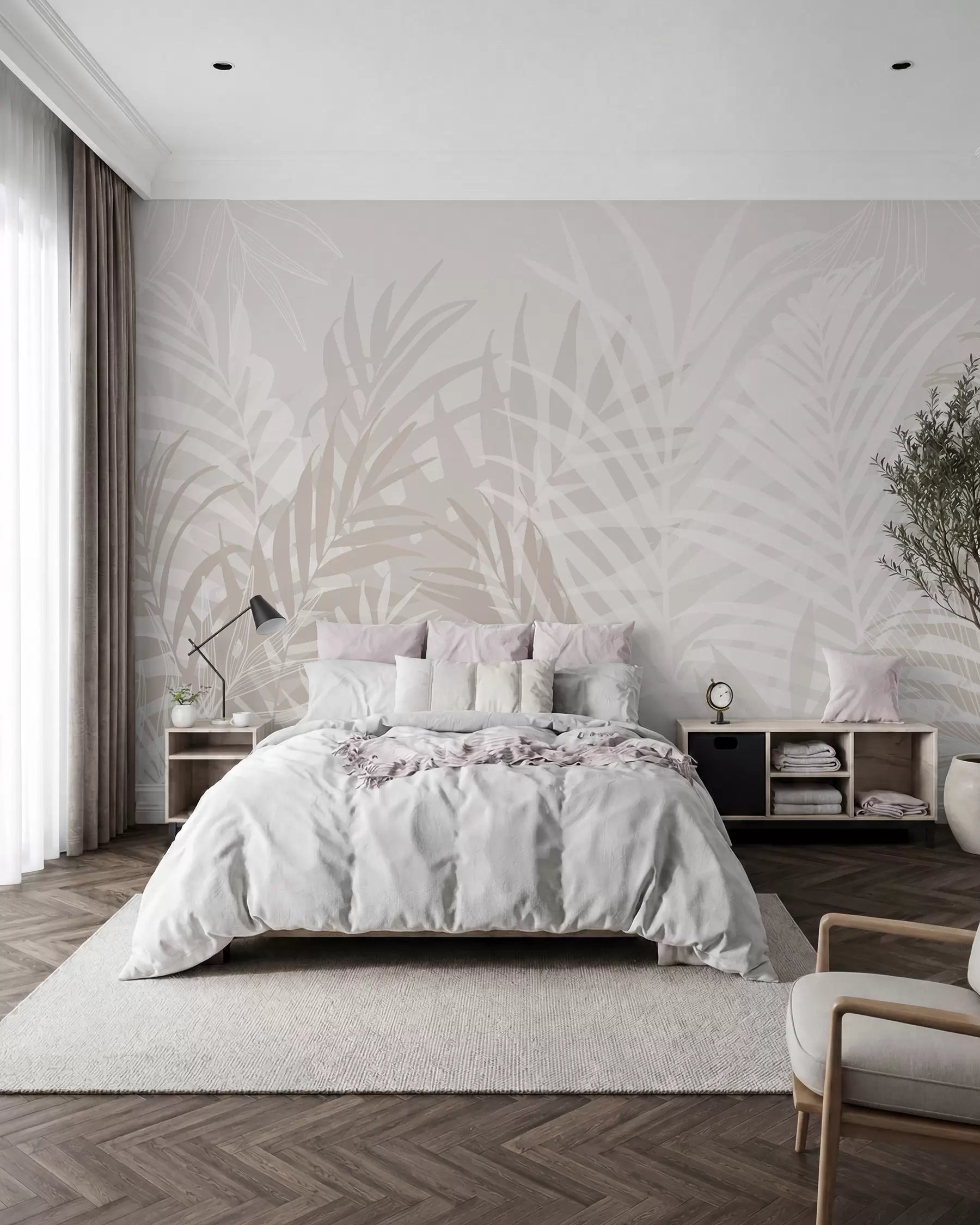 Soft grey tropical leaf mural behind a white bed with dark nightstands