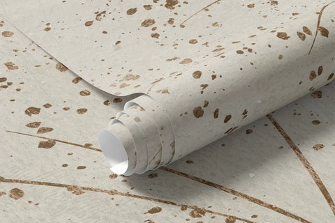 Rolled beige botanical mural wallpaper showing fine grass lines and speckled texture