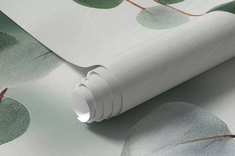 Rolled eucalyptus mural wallpaper with green leaves on white