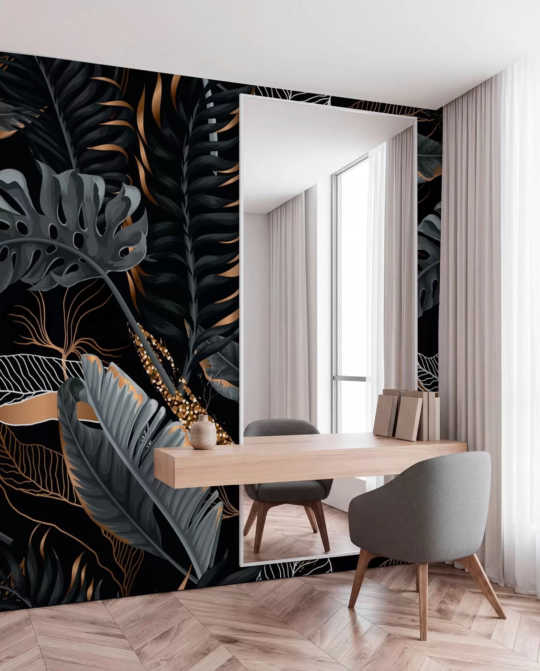 Dark tropical leaf mural in a room with a wooden desk and chair