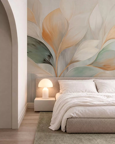 Abstract cream, peach and green leaf mural behind a bed in a bedroom with an arched doorway