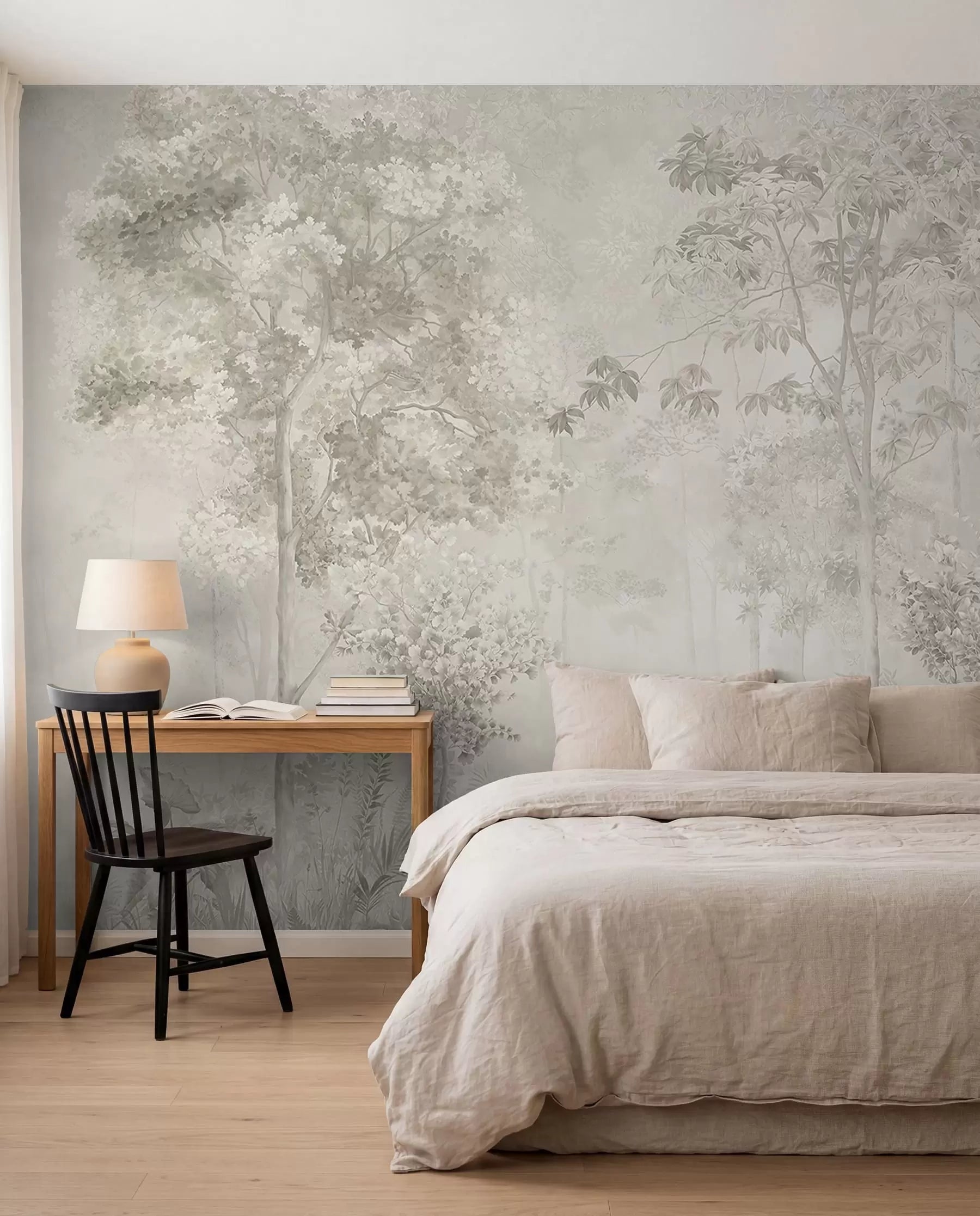 Woodland sketch mural behind a bed with linen bedding