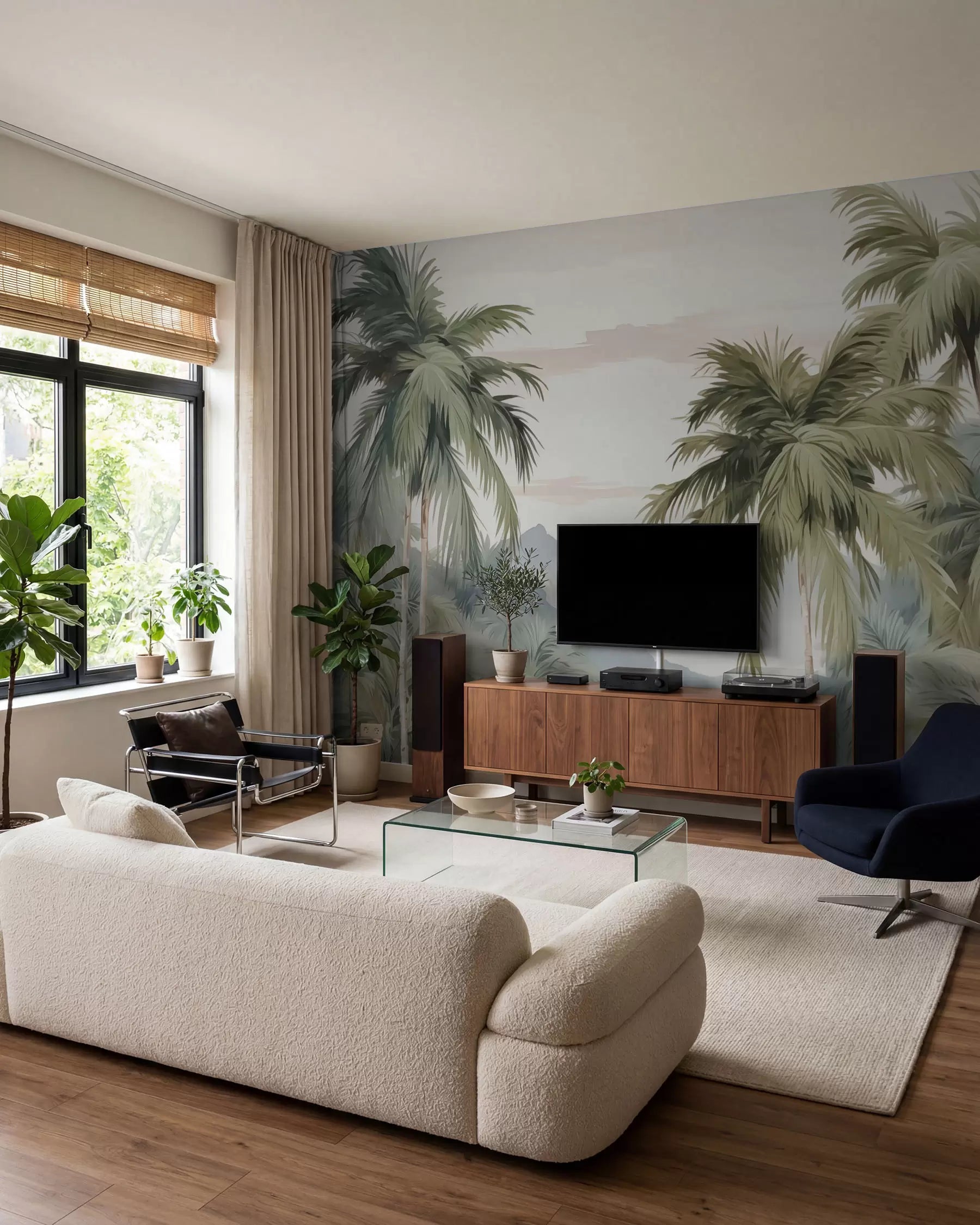 Watercolor palm trees wall mural in sage and misty grey behind a TV unit in a living room
