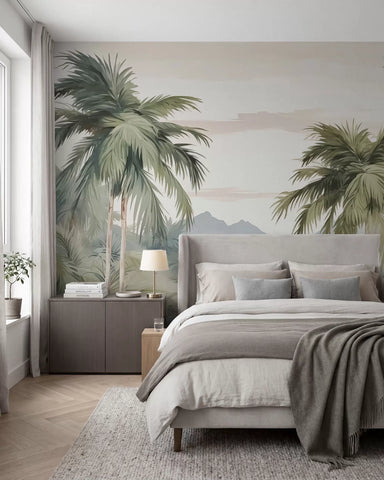 Soft green palm tree mural behind a bed with grey bedding