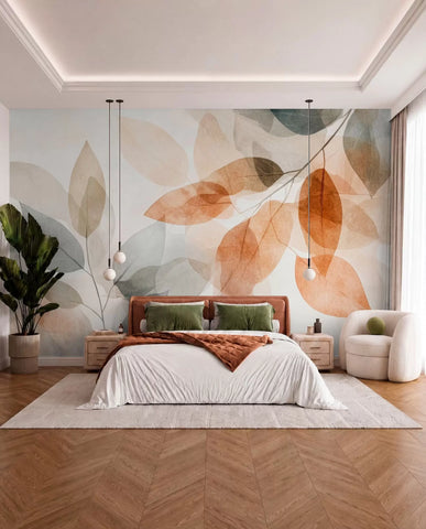 Translucent amber and grey leaves wall mural behind a bed with rust bedding and green cushions