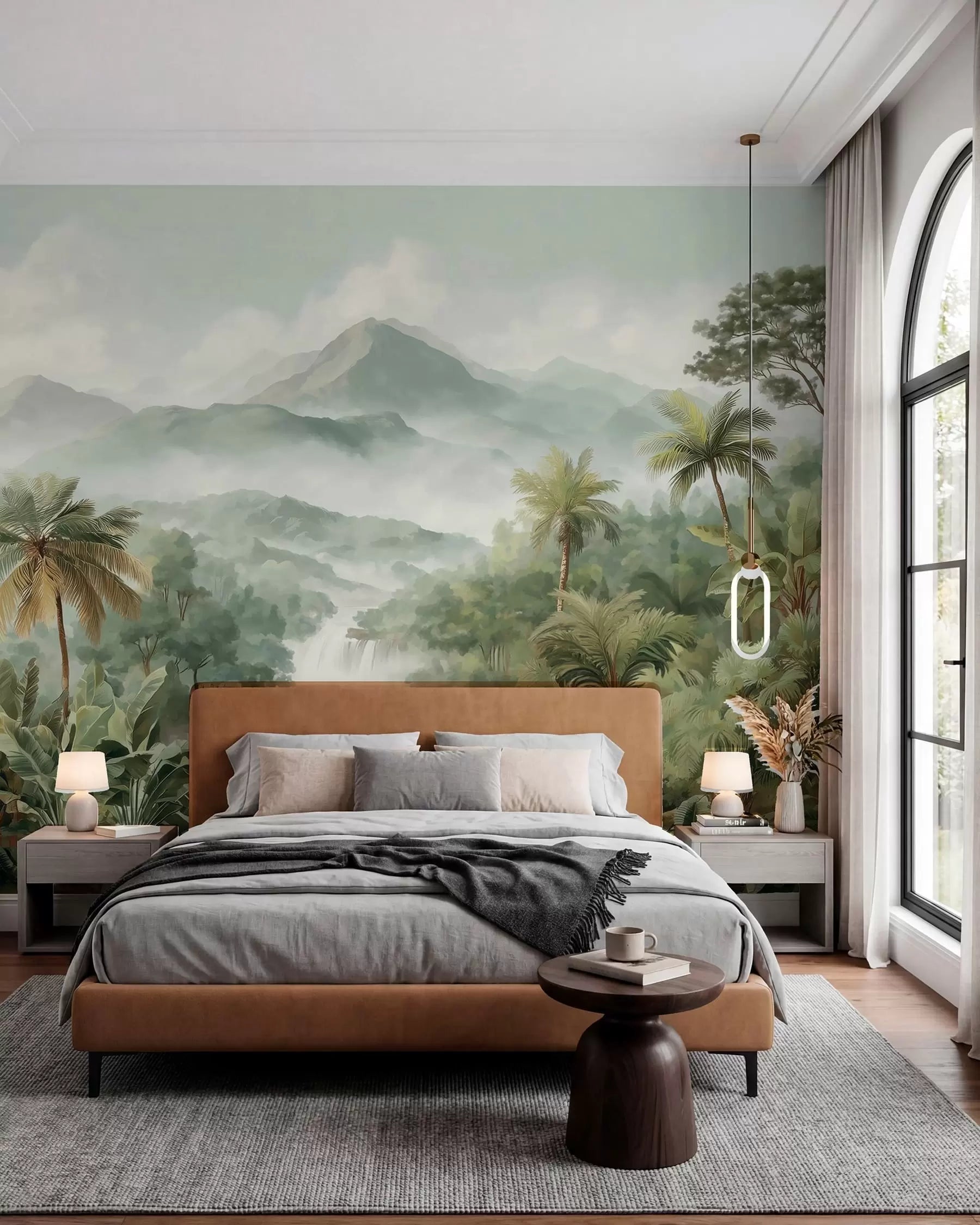 Misty jungle waterfall wall mural with palm trees and mountains behind a tan leather bed