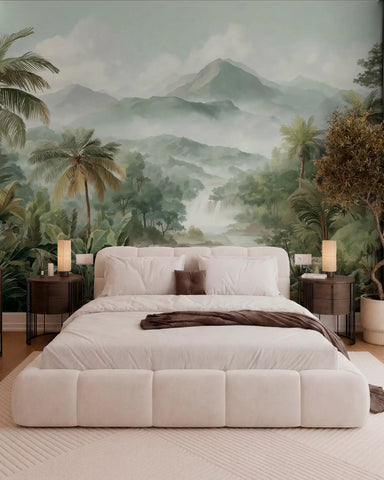 Soft green jungle landscape mural behind a white upholstered bed
