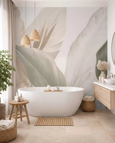 Soft leaf forms mural in a bathroom with a freestanding tub and wooden stool