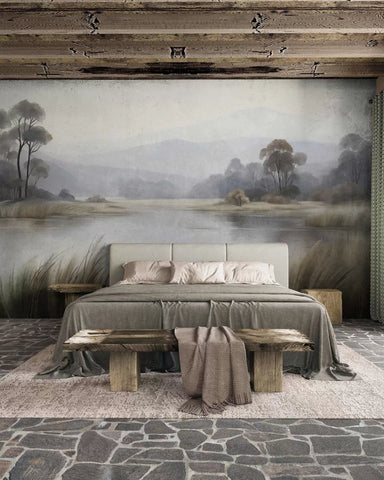 Misty sage lake landscape wall mural behind a bed in a rustic room with wooden beams