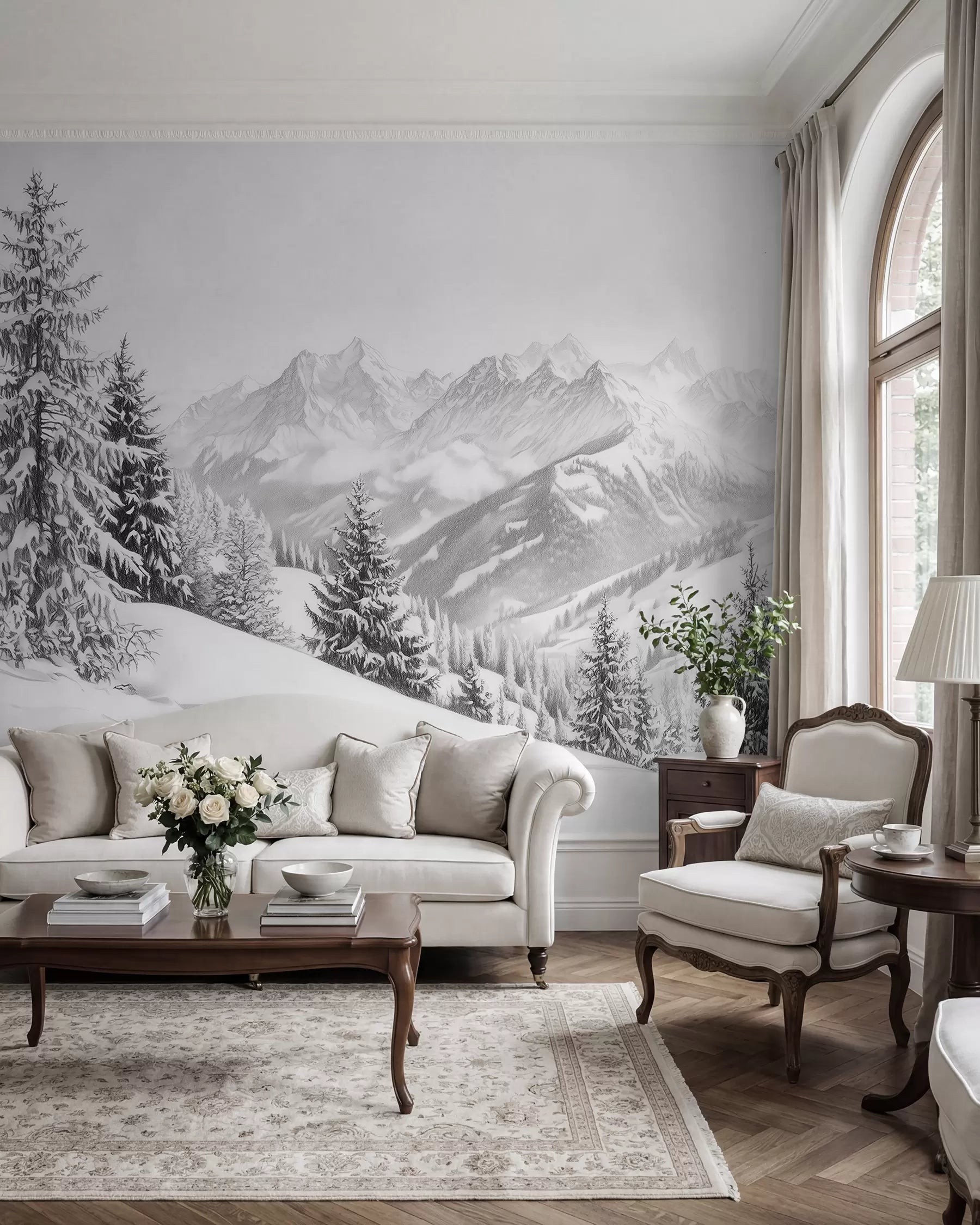 Snowy mountain view mural in a living room with a grey sofa and armchair