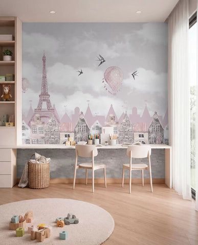 Pink Paris skyline mural above a kids' study desk with two chairs