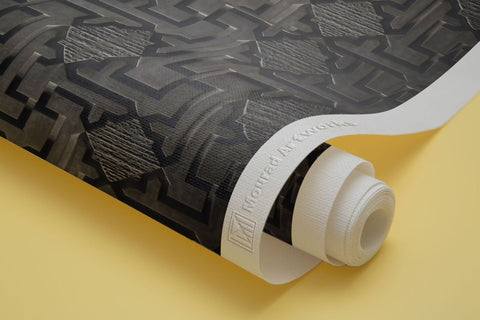 Monolith cube with labyrinth pattern floating above concrete floor